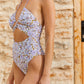 Side View View Of Flirtt Floral Halter Cut Out One Piece Swimsuit | FLIRTT FLORAL WHITE