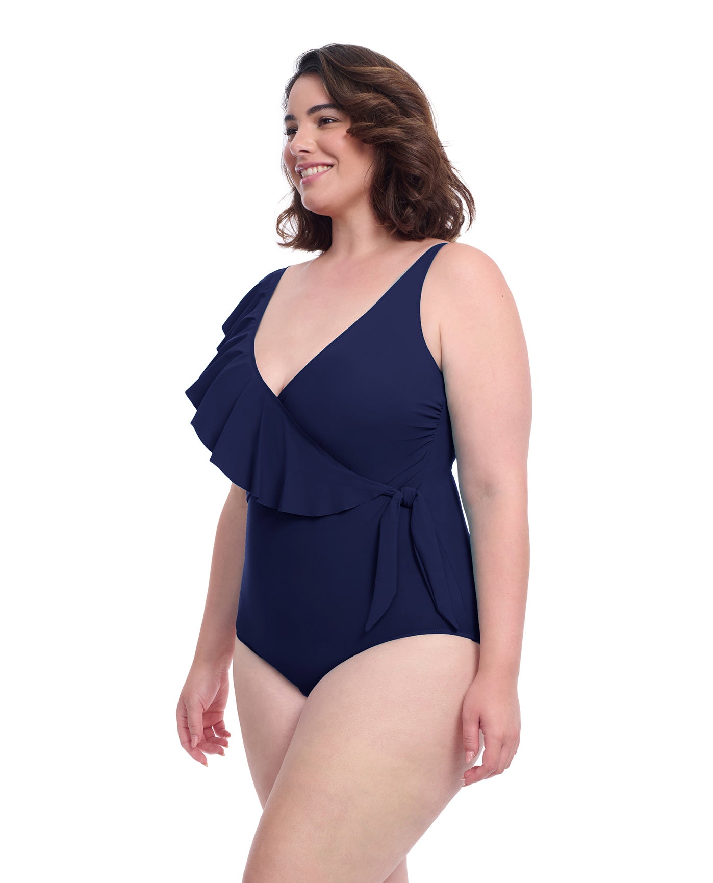 Side View of Profile By Gottex Tutti Frutti Plus Size Asymmetrical Ruffle Surplice One Piece Swimsuit | PROFILE TUTTI FRUTTI NAVY